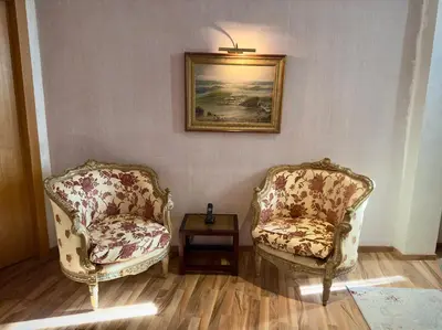 two chairs and a table in a room at Sillage Palace Sky & Spa in Marrakech