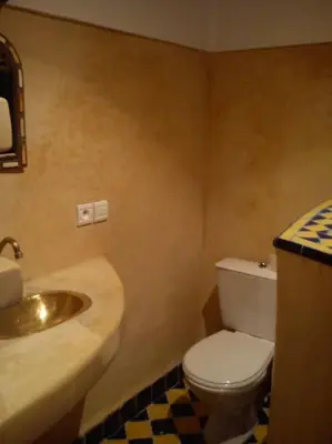 a bathroom with a sink and a toilet at Dar Sarah-Mouassine-Marrakech, Riad authentique idéalement situé in Marrakech