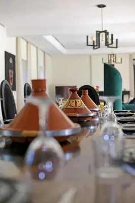 a table with some tea pots on top of it at Domaine DAR JMEL & Dar Abi Samama in Marrakech