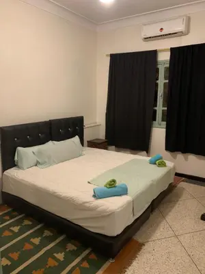 a bedroom with a large bed with blue towels on it at Dar el Koutoubia in Marrakech