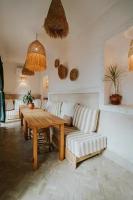 a living room with a couch and a table at Riad Nanou - Private Riad with Pool & Rooftop in Marrakech