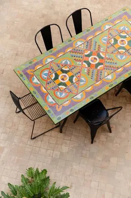 a table with a table cloth on top of it at Riad La Lumière d'Étoile in Marrakech