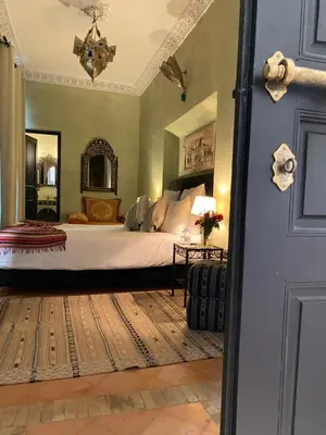 a bedroom with a large bed in a room at Riad Amegrad in Marrakech