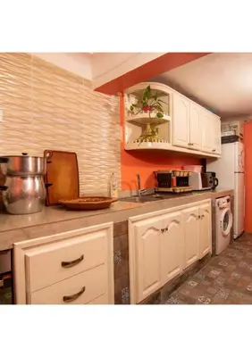 a kitchen with white cabinets and a sink at Dar Al Hayat in Marrakech