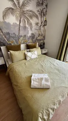 a bedroom with a bed with a towel on it at Studio sur golfe et piscine in Marrakech