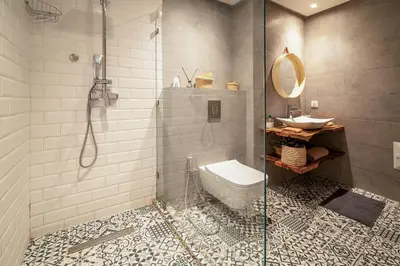 a bathroom with a shower and a toilet and a sink at Perle Rare à Bab Ighli Marrakech in Marrakech