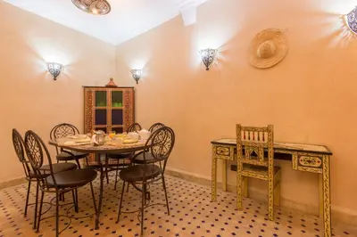a dining room with a table and chairs at Riad Colette EXCLUSIF - Médina - Breakfast - Wifi in Marrakech
