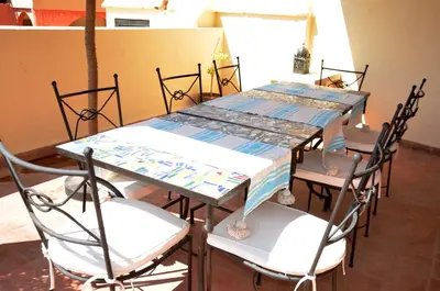 a dining room with a table and chairs at Riad Dar Hamid Hotel & Spa in Marrakech