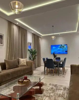 a living room with a couch and a table at Dar Sanaa Marrakech in Marrakech