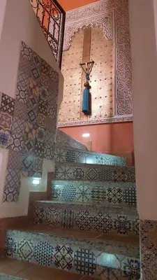 a church with tiled stairs with a cross on the wall at Riad De La Semaine in Marrakech