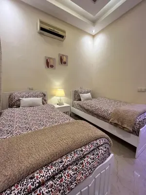 a bedroom with two beds and a window at Dar Anass Marrakech in Marrakech