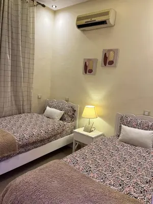 two beds sitting next to each other in a room at Dar Anass Marrakech in Marrakech