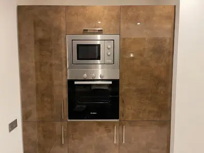 a microwave oven sitting inside of a cabinet at NEW SUPER LUXURY APARTMENT (CENTRAL MARRAKECH) in Marrakech