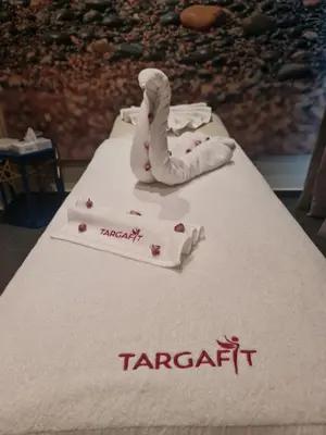 a table topped with a white table cloth with a towel at Targafit Hotel & Hammam in Marrakech