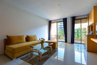 a living room with a couch and a table at AppartHotel Atrani in Marrakech