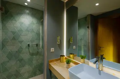 a bathroom with a sink and a shower at AppartHotel Atrani in Marrakech