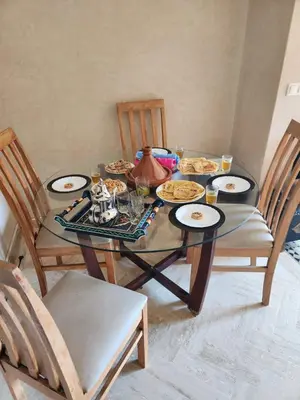 a dining room table with plates of food on it at Atlas golf in Marrakech