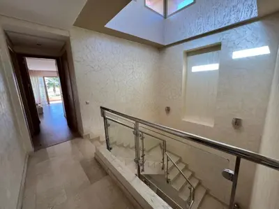 a bathroom with a staircase with a mirror and a skylight at Villa golf prestigia marrakech in Marrakech