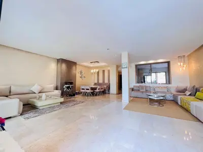 a living room with couches and a dining room at Villa golf prestigia marrakech in Marrakech