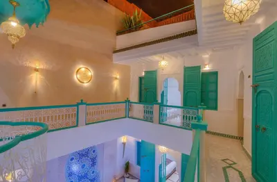 a view from the second floor of a house with a balcony at riad paradis blanc in Marrakech