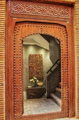 an ornate wooden frame with a staircase in a room at Riad Heva in Marrakech