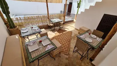an overhead view of a restaurant with tables and chairs at Riad Alizé in Marrakech