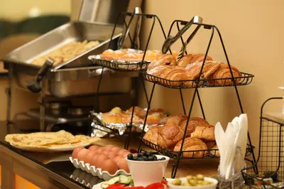 a bunch of breads and pastries on a buffet at Hotel Majorelle in Marrakech