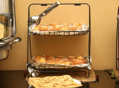 a bunch of pastries on a shelf in a kitchen at Hotel Majorelle in Marrakech