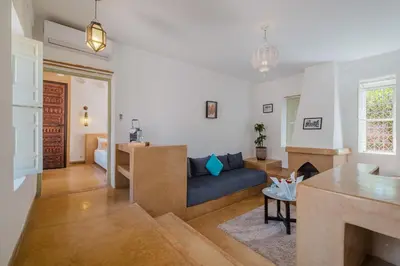 a living room with a couch and a table at Hôtel Dar 55 - Berber House - Boutique Hôtel in Marrakech