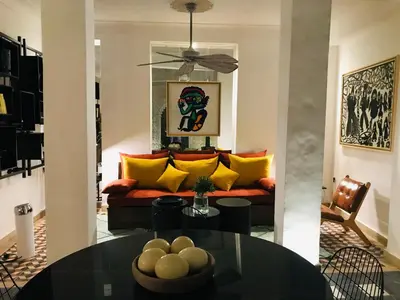 a living room with a couch and a table at Riad-Shakho-Marrakech in Marrakech