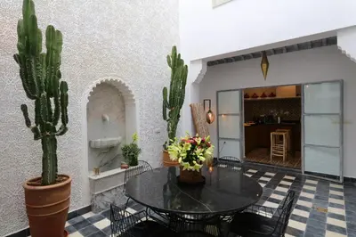 a room with a table and cactuses at Riad-Shakho-Marrakech in Marrakech