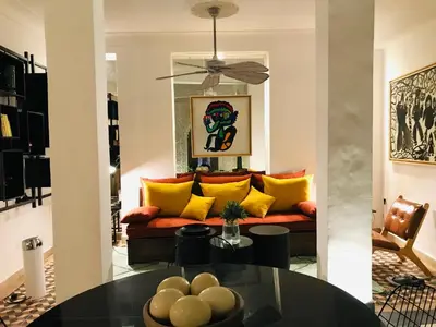 a living room with a couch and a table at Riad-Shakho-Marrakech in Marrakech