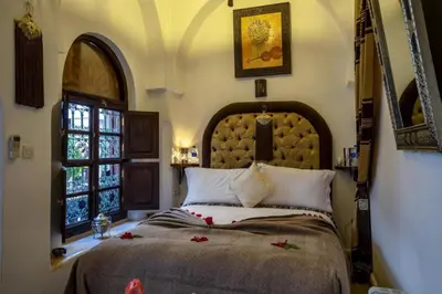 a bedroom with a large bed and a window at Room in BB - Riad Anabel - Chocolat Double Room in Marrakech