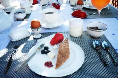 a plate with a piece of food on a table at Room in BB - Riad Anabel - Chocolat Double Room in Marrakech