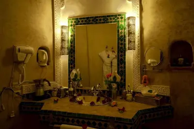 a bathroom with a sink and a large mirror at Room in BB - Riad Anabel - Chocolat Double Room in Marrakech