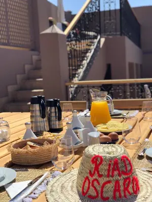 a table with food and a sign that reads la exporia at Riad Oscaroi in Marrakech