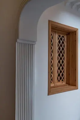a wall with a window and a radiator next to a wall at Riad Le Saadien ,Adult only in Marrakech