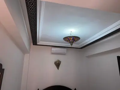 a ceiling with a chandelier in a room at diamant Marrakech centre in Marrakech
