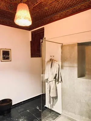 a mannequin in a glass case in a room at Riad Ksar Saad & Spa in Marrakech