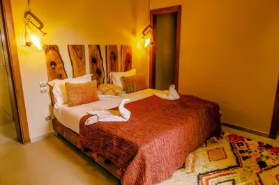a bedroom with two white swans on a bed at Villa des sœurs bradaa in Marrakech