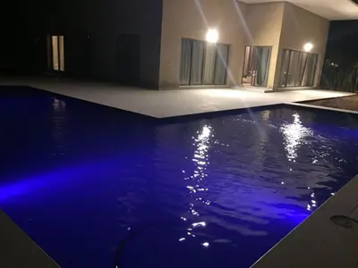 a swimming pool with blue lighting in a house at Villa Jamila -Villa de luxe a Marrakech in Marrakech