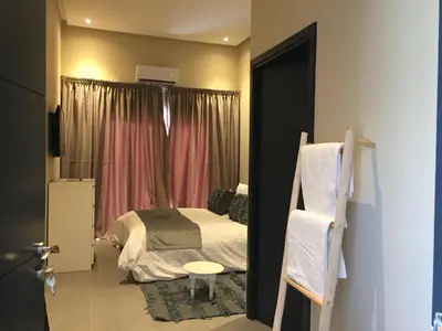 a small bedroom with a bed and a window at Villa Jamila -Villa de luxe a Marrakech in Marrakech