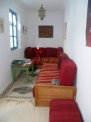 a living room with a couch and a table at Dar Daoud in Marrakech