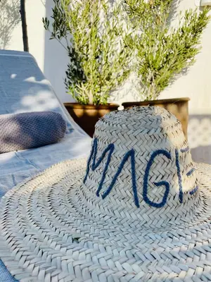 a cake with the m on it sitting on a table at RIAD MAGIE Boutique Hotel in Marrakech