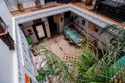 an overhead view of a living room with a table and chairs at Riad Vis Ta Vie in Marrakech