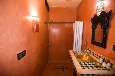 a bathroom with a sink and a shower at Riad Vis Ta Vie in Marrakech