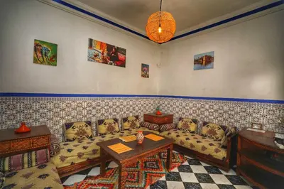 a living room with a couch and a table at Riad Amirkesh and Pool in Marrakech