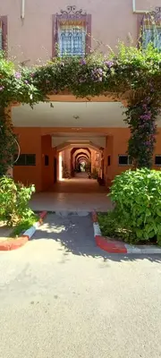 an entrance to a building with flowers on it at Riad Nour Travel in Marrakech