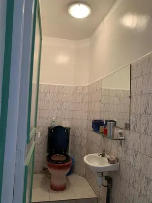 a bathroom with a toilet and a sink at APPARTEMENT PERLE RARE AU CENTRE DE MARRAKECH in Marrakech