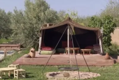 a gazebo in a field with a picnic table at RIAD - Jnan Bnati - Pool in Marrakech